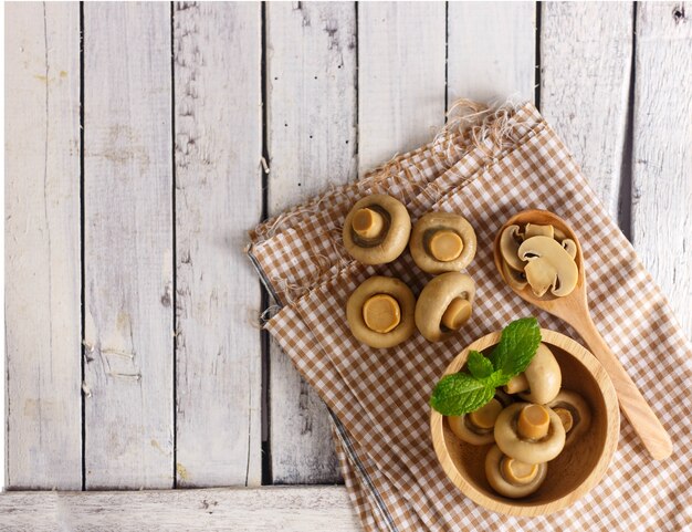 Group of preserve mushroom on white wood for cooking