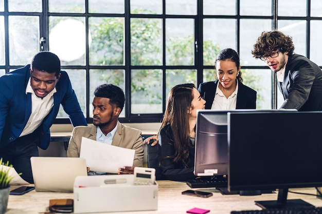 Group of professional business meeting and discussing strategy with new startup project.Creative african american man planning and brainstorm with laptop computer in modern office.Teamwork