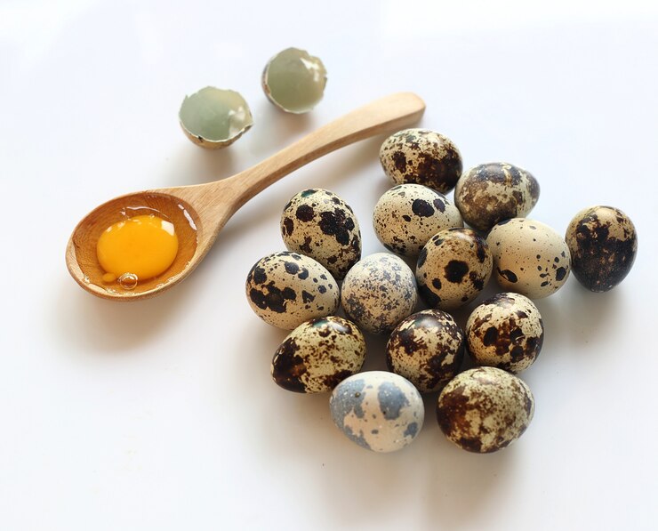 Group of quail eggs on white background