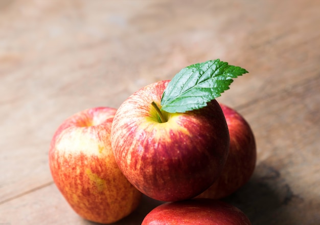 Group of red apple on wood table, red apple background