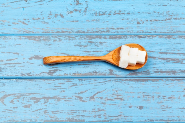 Group of refined white sugar cubes close up