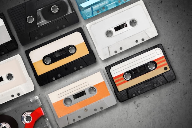 Group of retro cassettes on concrete background