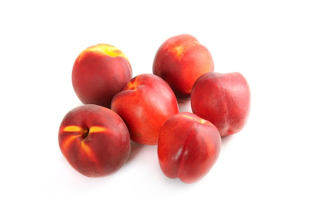 Group of ripe nectarines isolated on white