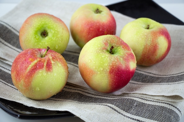 A group of ripe red and yellow apples.