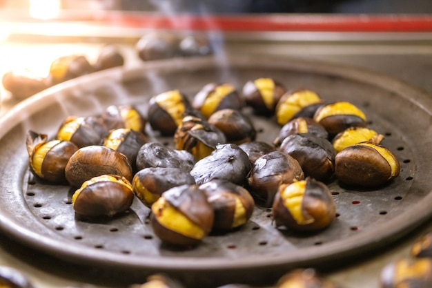 Group of roasted chestnuts for sale on the street