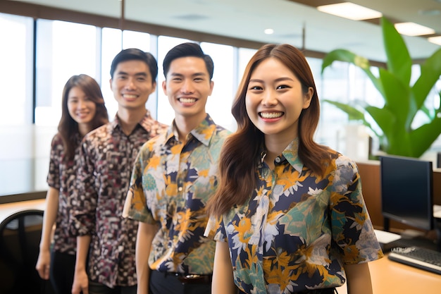 A group of sales team employee wearing batik smile office background