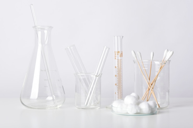 Photo group of scientific laboratory glassware with clear liquid solution