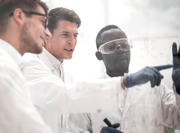 Group of scientists discusses the information and makes notes