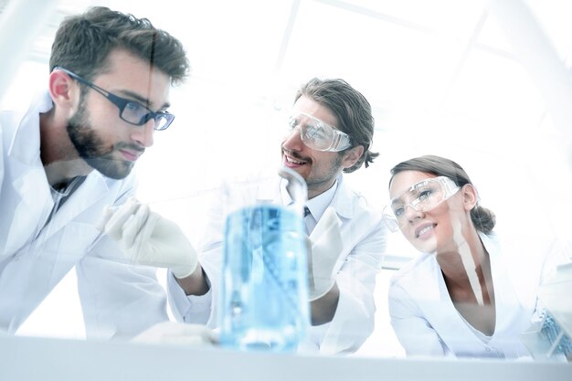 Group of scientists working on an experiment at the laboratory