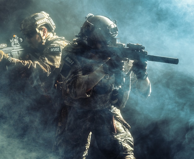 Group of security forces in Combat Uniforms with rifles