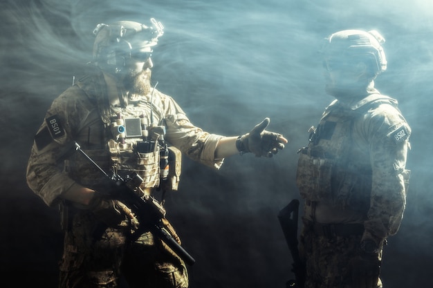 Group of security forces in Combat Uniforms with rifles