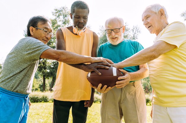 Group of senior friends playing at the park. Lifestyle concepts about seniority and third age