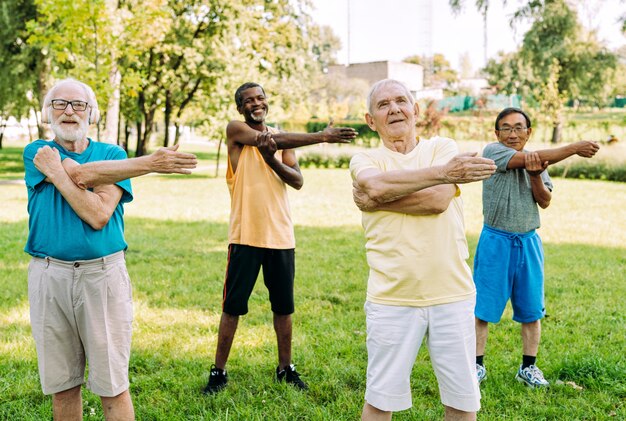 Group of senior friends training at the park Lifestyle concepts about seniority and third age