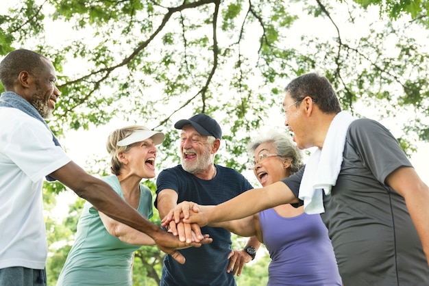 Photo group of senior retirement exercising togetherness concept