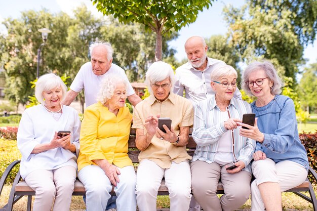 Group of seniors people bonding at the park