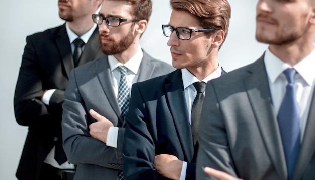 Group of serious business people standing in a row