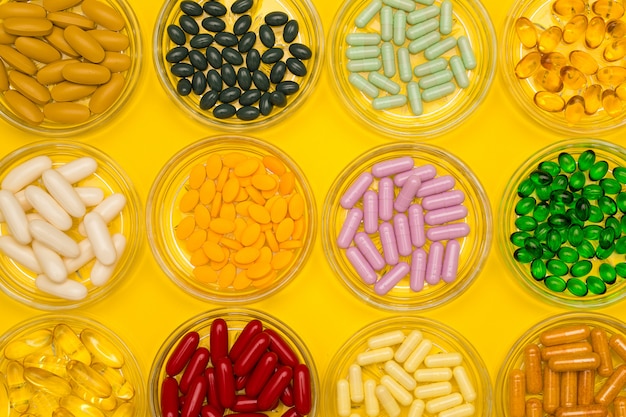 Group of several sizes of pills in glass