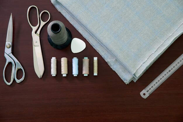 Group of sewing objects on a wooden table