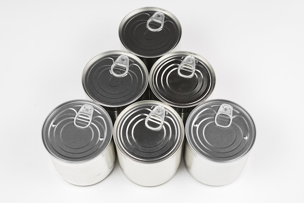 Group of silver canned food on white background