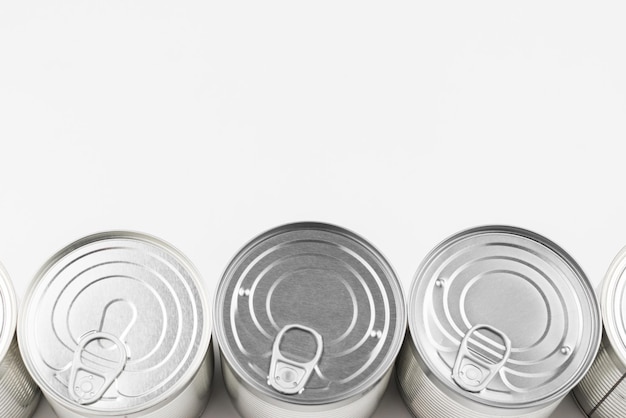 Group of silver canned food on white background