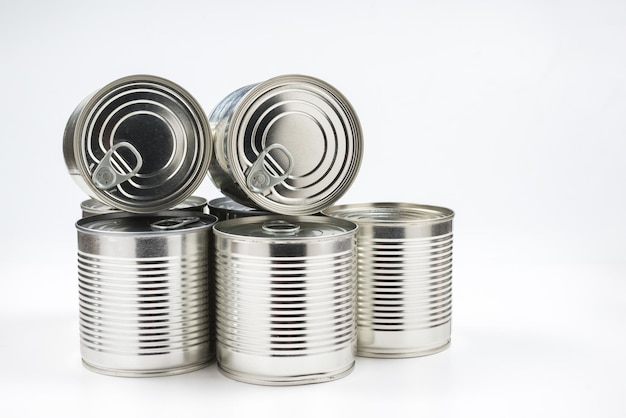 Group of silver canned food on white background