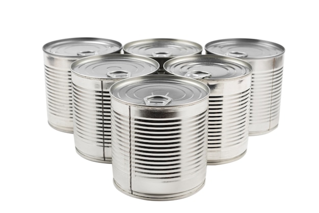 Group of silver canned food on white surface.
