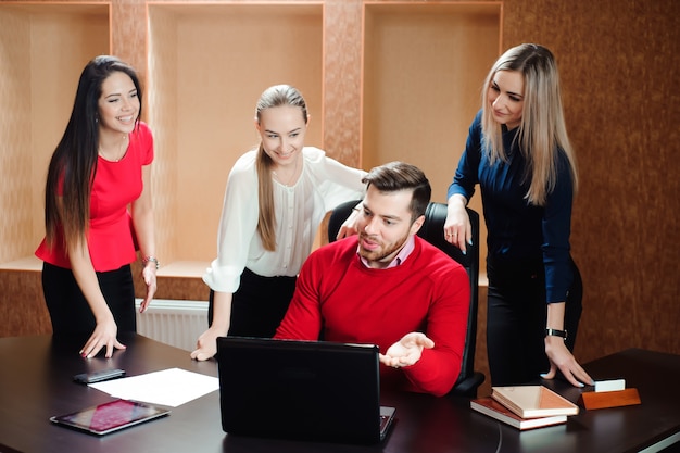 Group of smiling inspired young business people working together