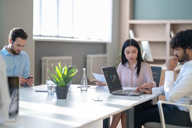 Group of specialists working in the office