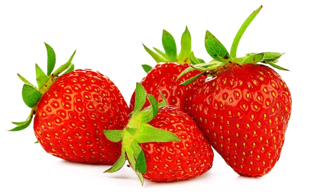 Group of strawberries with leaves isolated on a white background.