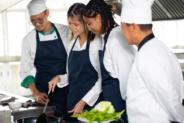 Group of student teen girl learning Cooking class culinary classroom group of happy young woman multi ethnic students are focusing on cooking lessons in a cooking school