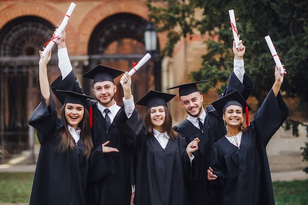 Group of students attending graduation ceremony. Nice day