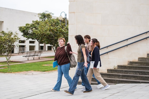 Group of students leaving the library in the university exam season