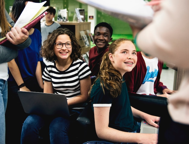 A group of students listening in the library