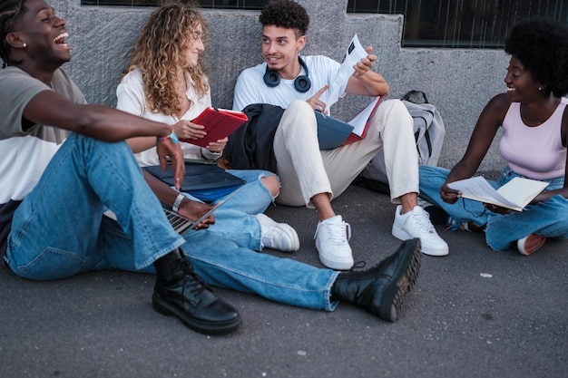 Group of students sharing notes and studying together before the exam concept studies