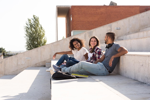 Group of students sitting on school stairs