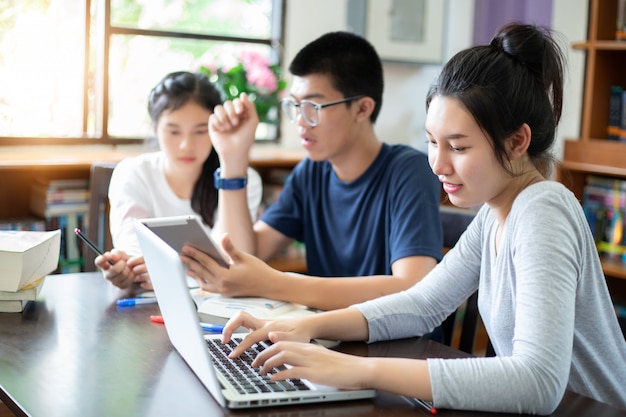 Group Students Smile and have fun and using tablet