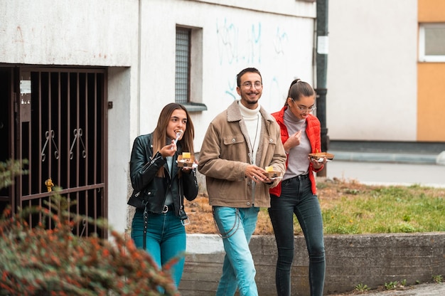 A group of students takes a break from college to rest and talk and eat delicious sweetsSelective focus High quality photo