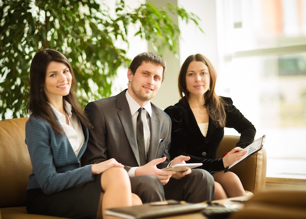 A group of successful businessmen. Discussion of the important contract of the company.