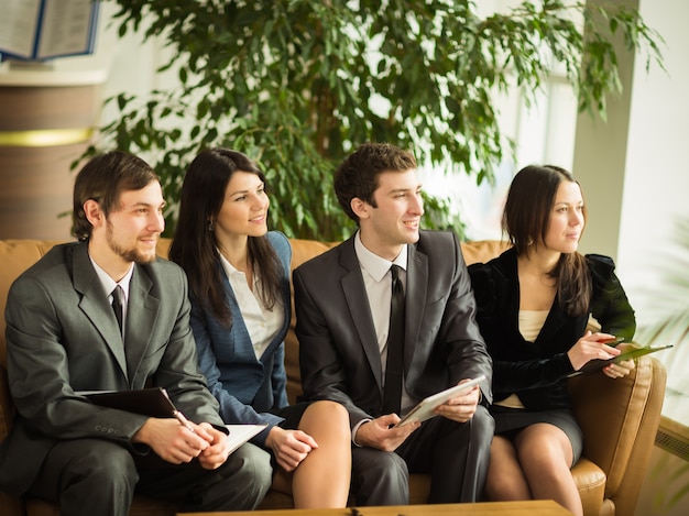 A group of successful businessmen. Discussion of the important contract of the company.