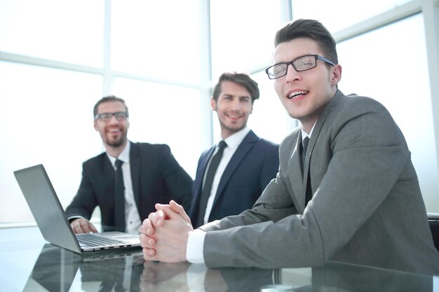 Group of successful businessmen sitting at the Desk