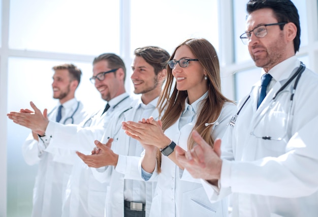 Group of successful doctors applauds the concept of good work