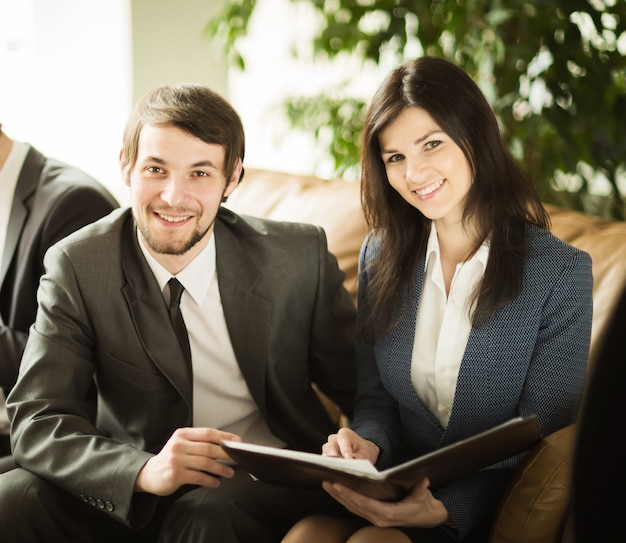 A group of successful entrepreneurs discussion of an important document in the office