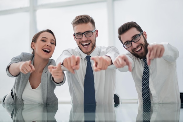 Group of successful young men pointing at youthe concept of choice