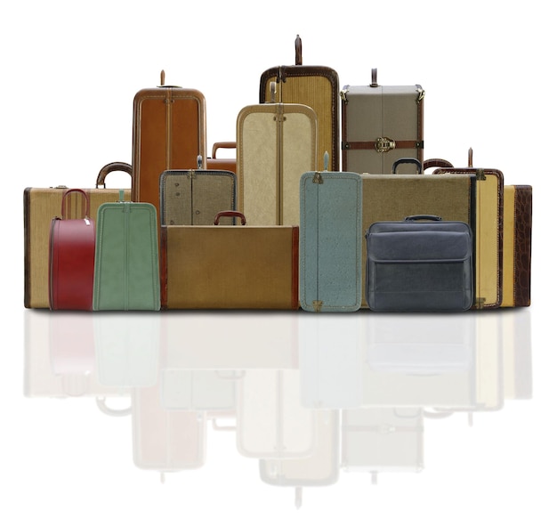 a group of suitcases are arranged in a pyramid.