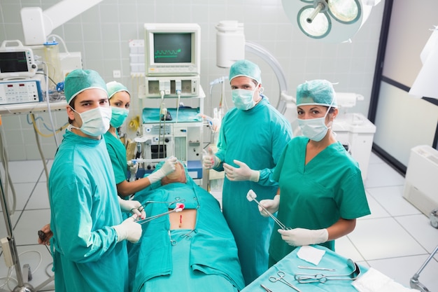 Group of surgeon working on a patient in an operating theater