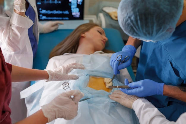 A group of surgeons doing operations in a hospital.