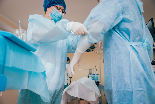 group-surgeons-operating-room-with-surgery-equipment_179755-2306.jpg
