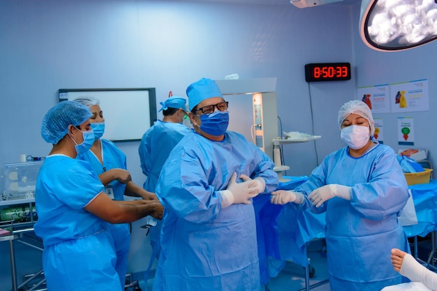 Group of surgeons in operating room