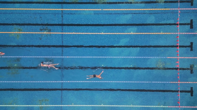 Group of swimmers training in an outdoor pool top view