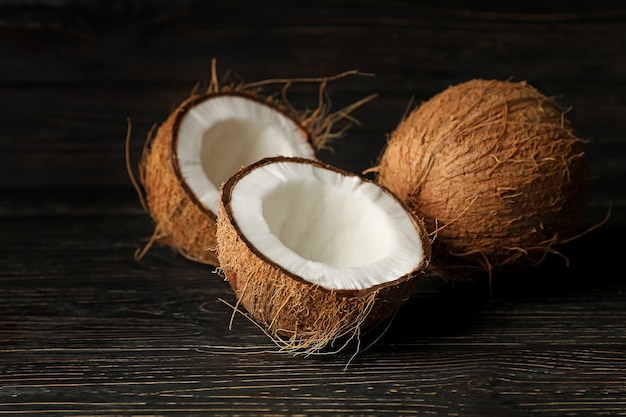 Group of tasty fresh coconut on wooden background